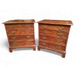 A pair of George III revival bachelors chests of drawers, each holding four long graduated cock