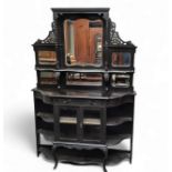 A Victorian ebonised chiffoniere, six bevelled mirror panes, the projecting base with open