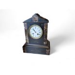 A late 19th century slate and marble mantel clock, Roman numerals, twin winding holes, striking on a