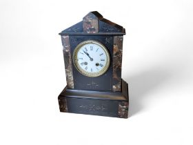 A late 19th century slate and marble mantel clock, Roman numerals, twin winding holes, striking on a