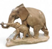 A Lladro model, of a mother elephant and her calf, 21cm high, printed mark