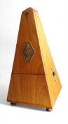 A 19th century French metronome, brass plaque marked 1815 Naelzel Paquet 1846, 23cm high