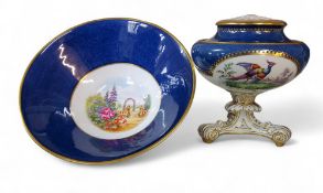 A Copeland Spode pedestal vase and cover, printed with fanciful birds, on a powdered blue ground,