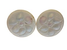A pair of Royal Worcester circular oyster plates, with seven  receptacles, on a basketwork ground,