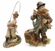 A Capo-Di-Monte figure group, C'est La Vie, modelled with a tramp, repairing his clothes, 32cm high,