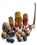 A Russian doll;  hardstone eggs;  carpet boules,  Plique-à-jour egg;  etc