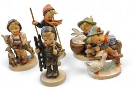 A Goebel figure, by MI Hummel, Little Goat Herder, large bee mark, 200/0;  others, Skier, Playmates,