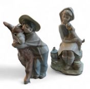 A Lladro group,  Platero & Marcelino, Boy with Donkey, printed mark;   another, Puppy Love (2)