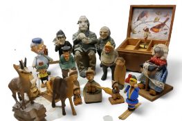 Swedish and other wooden carvings - elk, fisherman, skier, gnomes;  a musical box;  etc