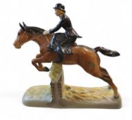 A Beswick huntswomen, riding side saddle, jumping, 26cm high, printed mark, model no. 982
