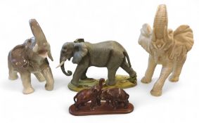 A model of an elephant, 23cm high,  impressed 2217;  a resin elephant;  others
