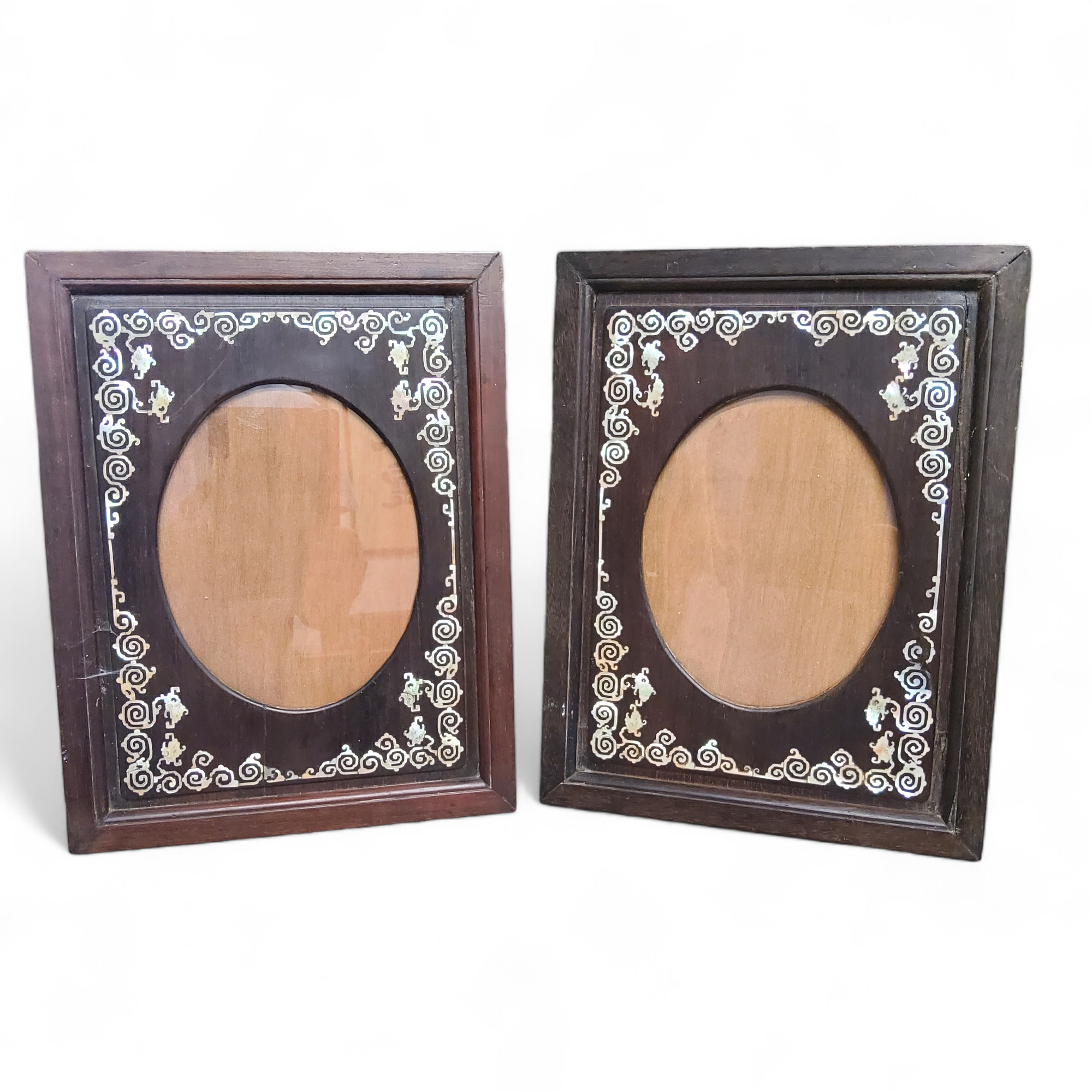 A pair of 19th century Chinese hardwood and mother of pearl frames, each 38cm x 29cm