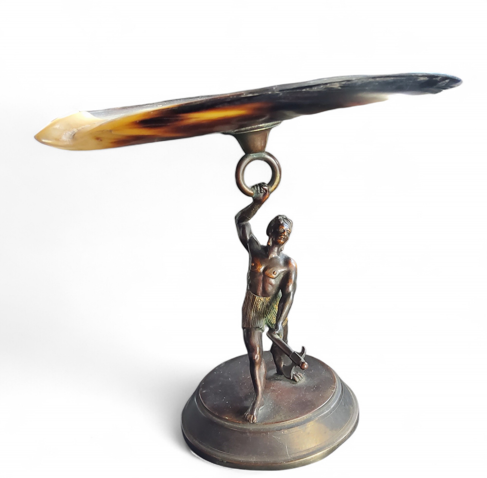 An early 20th century novelty figural tazza, mother-of-pearl shell top, warrior stand, circular