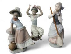 A Lladro figure, Rumba, 5160;  others, A Step in Time, 5158;  Clean Sweep, 5025 (3)