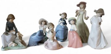 A Nao figure, of a lady feeding rabbits;   others (7)