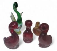 Three Whitefriars glass ruby red Dilly Ducks, designed by Geoffrey Baxter, 13cm high;   an orange