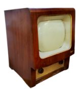 A retro G.Masconi television with walnut housing, metal grill speaker with bakelite tuning handles