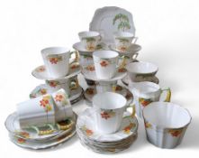 An Art Deco Royal Stafford tea service;  another, Bell China