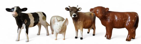 A Beswick Jersey cow, CH Newton Tinkle, designed by Arthur Gredington, 12cm high, printed mark model