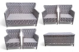 A modern rattan garden furniture set by 'Supremo Leisure' including a two seater sofa, four