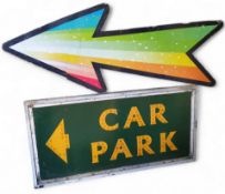 A substantial sign written fairground car park sign in yellow and green; a multicoloured