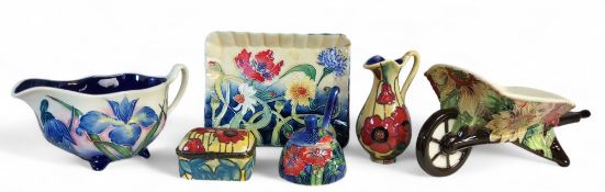 An Old Tupton Ware wheel barrow, tube lined with stylised flowers, printed mark, boxed;  a similar