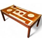 A mid 20th century teak coffee table with geometric treacle glazed tile design, possibly Danish,
