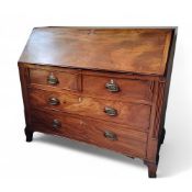 A George III mahogany bureau, the fall front above two short and three long drawers, fluted
