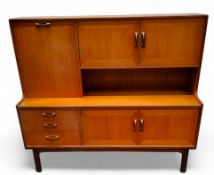 A mid 20th century teak G-Plan 'Sierra range' high-backed sideboard c.1970, fall front over a bank