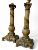 A pair of 19th century French alabaster and gilt metal mantel sticks, the bases cast with swags