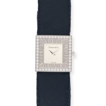 TIFFANY & CO. - A DIAMOND TIFFANY ATLAS COCKTAIL WATCH in 18ct white gold, the square silvered di...