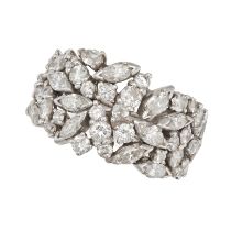 A DIAMOND DRESS RING in white gold, the tapering ring set with clusters of round brilliant and ma...