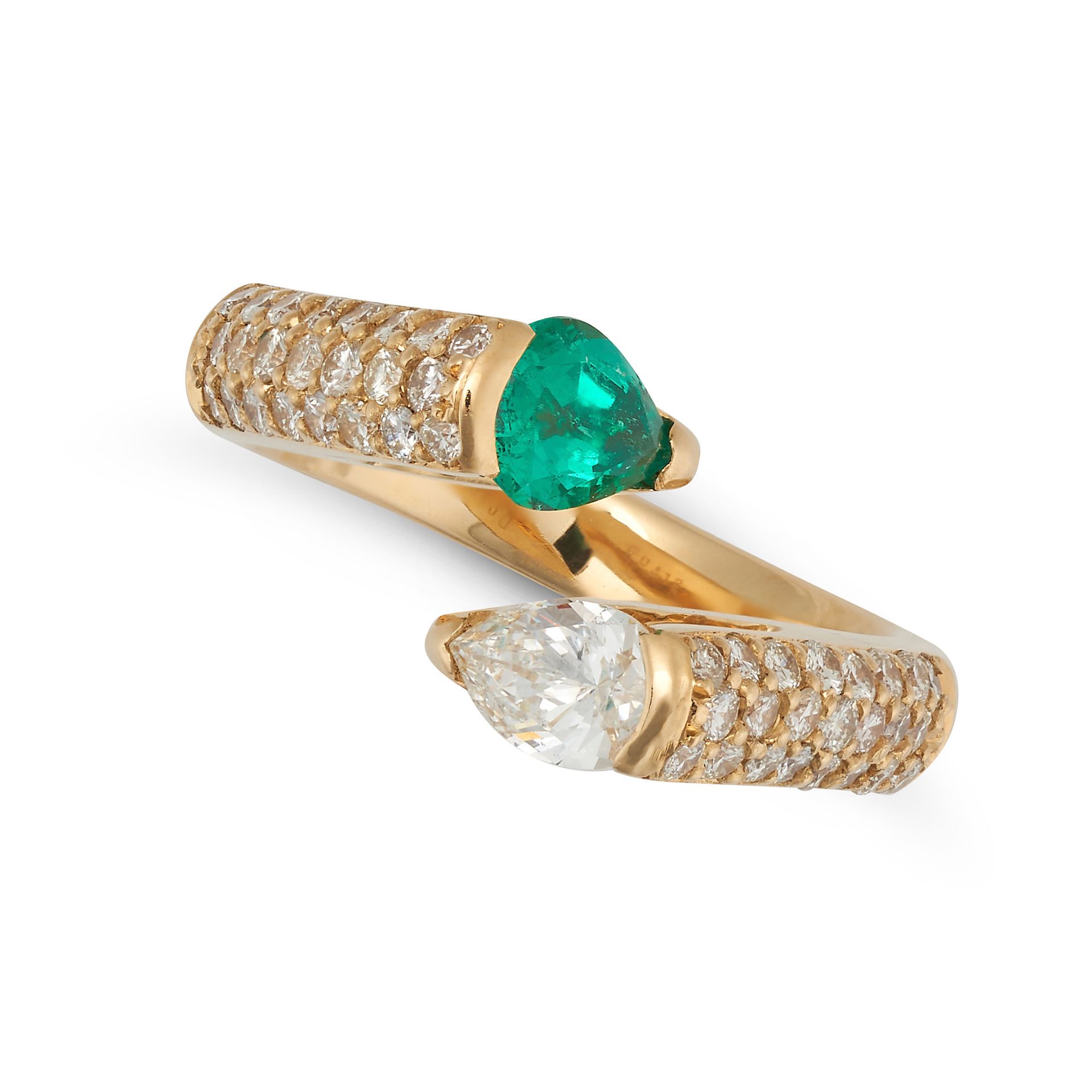 AN EMERALD AND DIAMOND TOI ET MOI RING in 18ct yellow gold, set with a pear cut emerald and a pea...