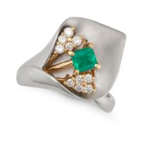 AN EMERALD AND DIAMOND LILY RING in platinum and 18ct yellow gold, designed as a peace lily set w...