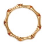 AN ITALIAN CITRINE BRACELET in 18ct yellow gold, comprising a row of fancy links accented by roun...