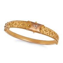 AN ANTIQUE VICTORIAN DIAMOND BANGLE in yellow gold, the bangle set to the centre with a trio of o...