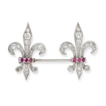 A DIAMOND AND RUBY FLEUR DE LIS JABOT PIN in white gold and platinum, comprising two fleur de lis...