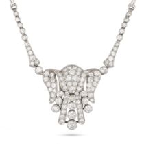 A FINE DIAMOND NECKLACE / BROOCH in 18ct white gold, the scrolling pendant set throughout with ro...