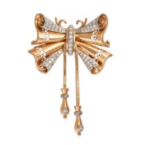 A RETRO DIAMOND BOW BROOCH / PENDANT in yellow gold, designed as a stylised bow set with single c...