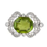A FINE ANTIQUE PERIDOT AND DIAMOND BROOCH in yellow gold and silver, set with an octagonal step c...