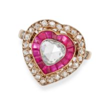 A DIAMOND AND RUBY TARGET RING in yellow gold, the heart shaped face set with a rose cut diamond ...
