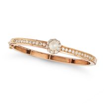 AN ANTIQUE NATURAL SALTWATER PEARL AND DIAMOND BANGLE in yellow gold, set with a pearl of 6.4mm i...