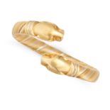 CARTIER, A VINTAGE PANTHERE DE CARTIER BANGLE in 18ct yellow, white and rose gold, the flexible b...