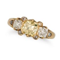 A FANCY AND WHITE DIAMOND DRESS RING in yellow gold, set with a cushion shaped old cut yellowish ...