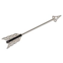 AN ART DECO ONYX AND DIAMOND ARROW JABOT PIN BROOCH in white gold, the quiver set with a row of r...