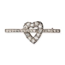 AN ANTIQUE DIAMOND HEART BROOCH in yellow gold and silver, designed as an open heart pierced by a...
