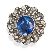 A SYNTHETIC SAPPHIRE AND DIAMOND RING in yellow gold, set with an oval cut synthetic sapphire in ...