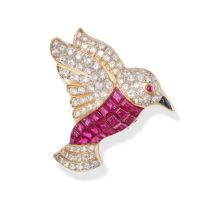 A DIAMOND, RUBY, AND SAPPHIRE BIRD BROOCH in yellow gold, the body of the bird invisibly set with...