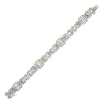 A DIAMOND BRACELET in platinum, comprising a row of geometric links set with round brilliant, old...