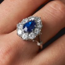 A FINE CEYLON NO HEAT SAPPHIRE AND DIAMOND CLUSTER RING in 18ct white gold and platinum, set with...